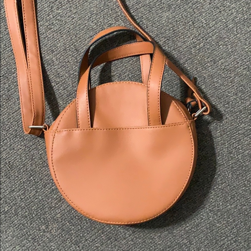 Brown circular crossbody bag